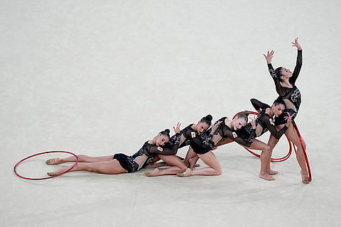 The team from Spain performs their hoop exercise in the rhythmic gymnastics
